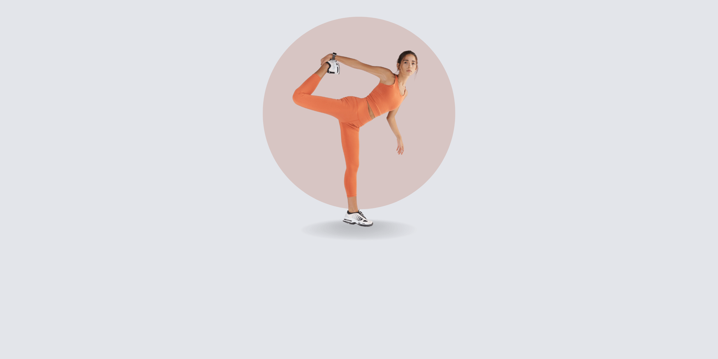Model balancing on one leg in a yoga pose.